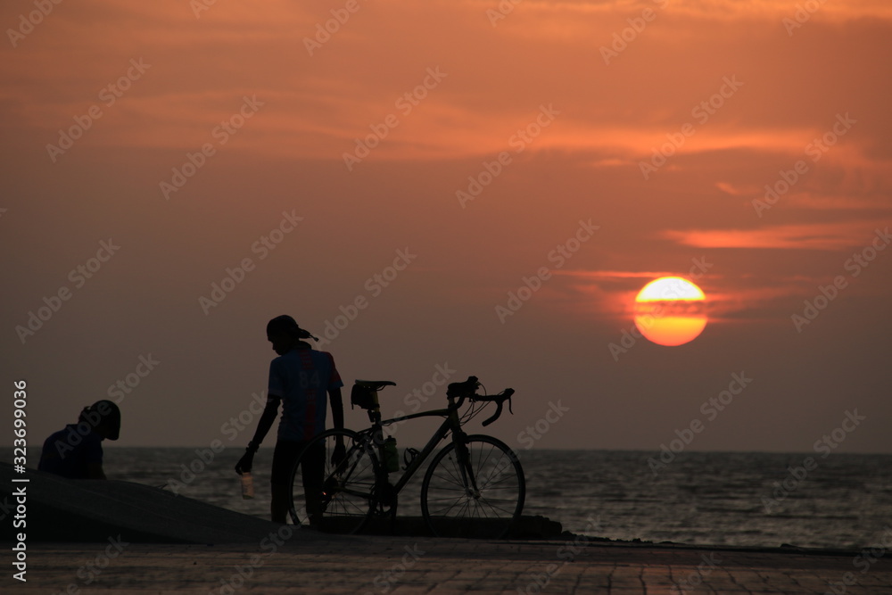 silhouette of cyclist at sunrise silhouette of cyclist at sunrise