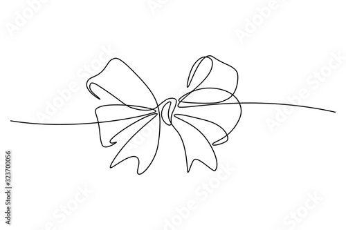 Gift ribbon bow in continuous line art drawing style. Minimalist black linear sketch isolated on white background. Vector illustration photo