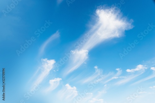 Beautiful white clouds on a blue sky background. Clouds Like a brush strokes © kvitkanastroyu