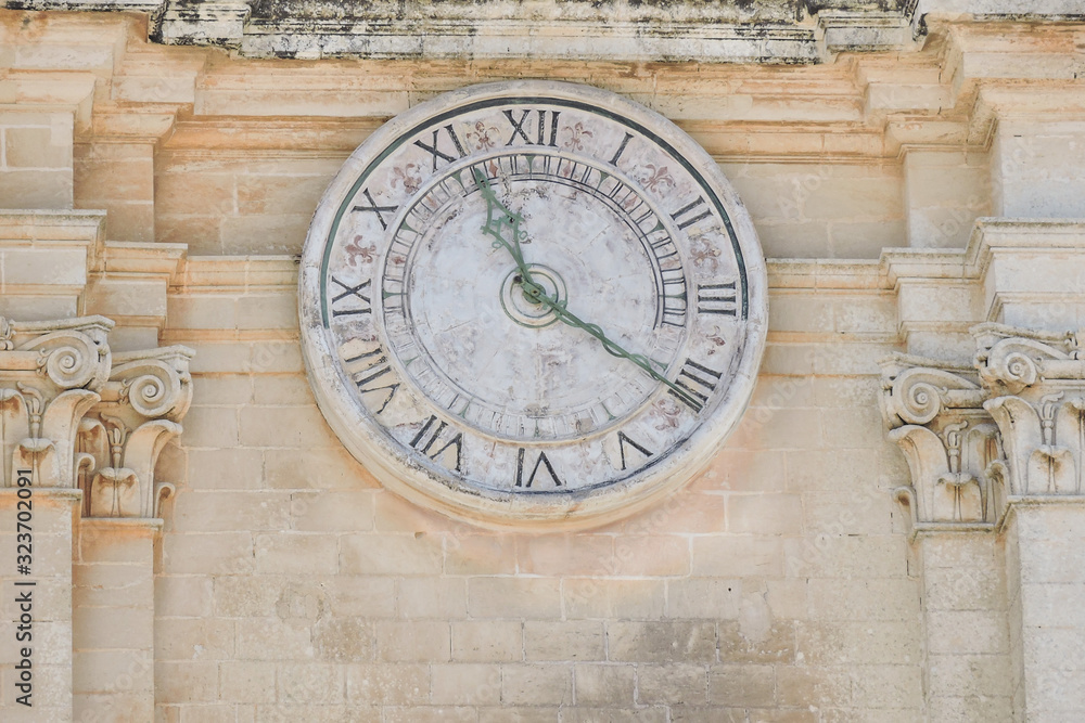 The ancients clock on old building