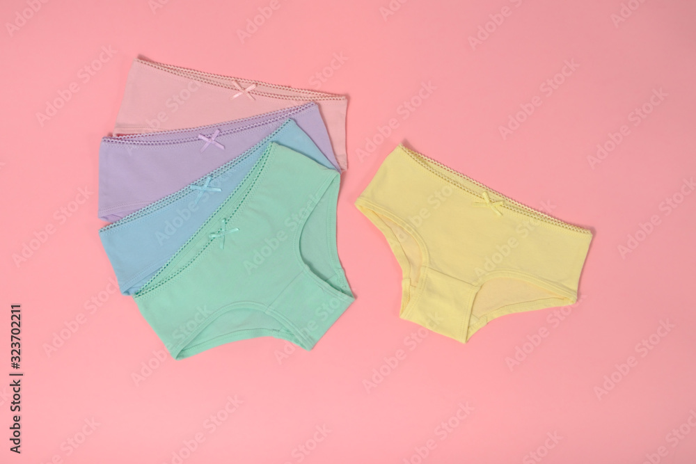 multi-colored cotton panties for a girl on a pink background