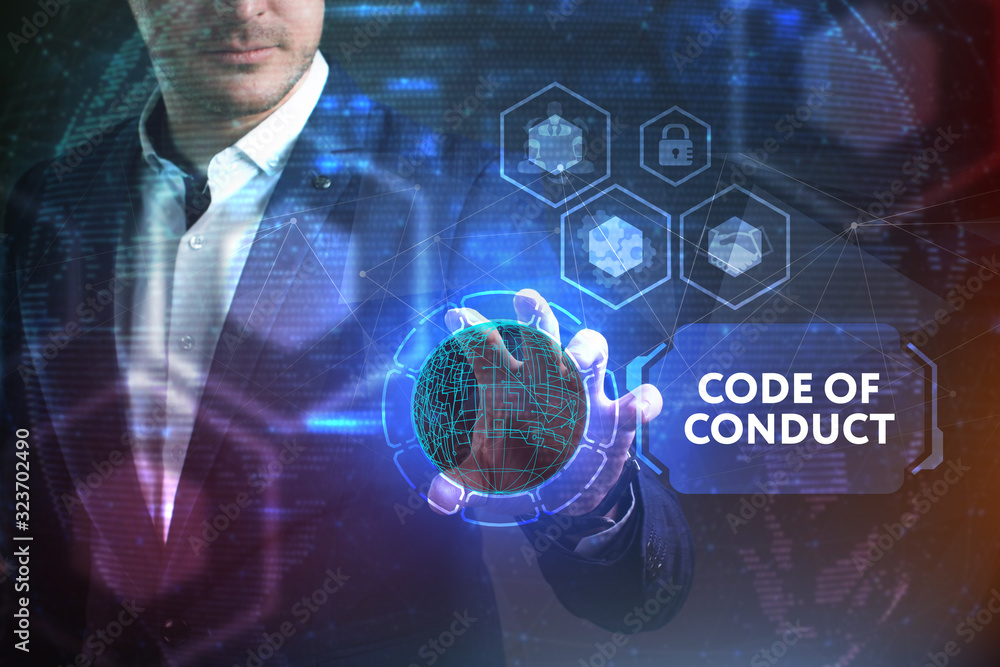Business, Technology, Internet and network concept. Young businessman working on a virtual screen of the future and sees the inscription: Code of conduct Business, Technology, Internet and network concept. Young businessman working on a virtual screen of the future and sees the inscription: Code of conduct