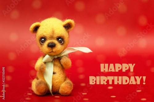Present teddy bear, text Happy Birthday. Greeting card, poster, background © 8H
