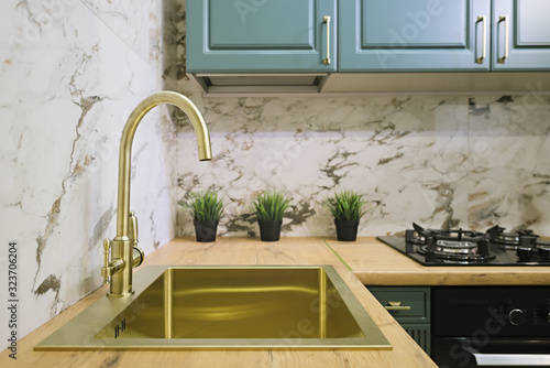 Brass kitchen sink in gold color