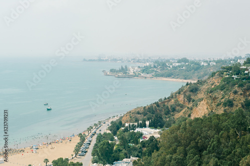 A small harbor with sailboats in the Mediterranean Sea in the city of Sidi Bou Said near Tunisia