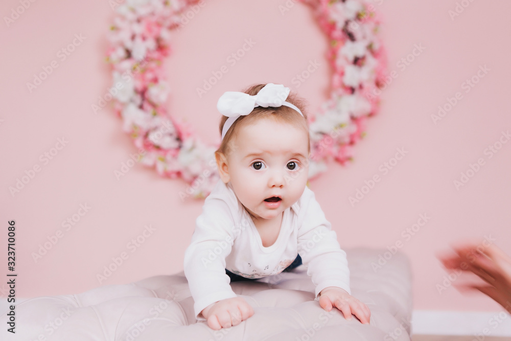 Image of sweet adorable baby girl with pink flowers Image of sweet adorable baby girl with pink flowers