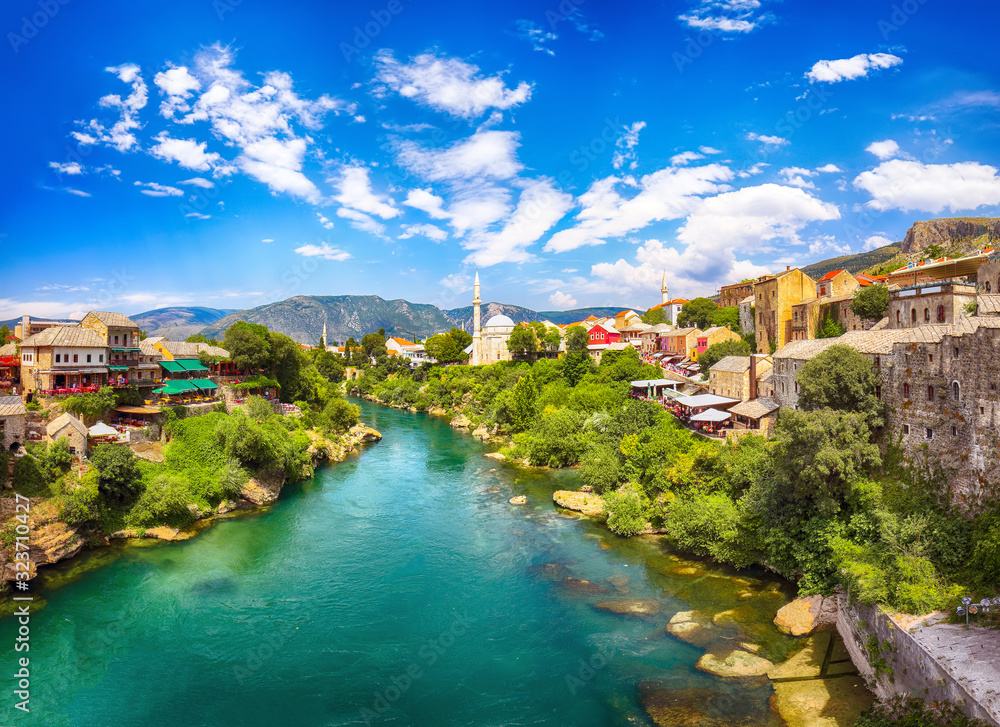 Nerteva River and Old City of Mostar, with Ottoman Mosque  during sunny day