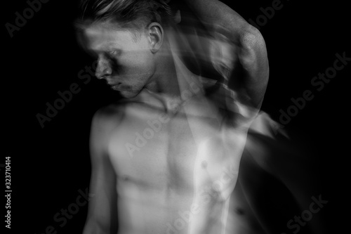 attractive handsome naked man portrait. Black and white. Long exposure. doubt and suffering. romantic relationship. jealousy or cheating. Emotional double personality portrait. 