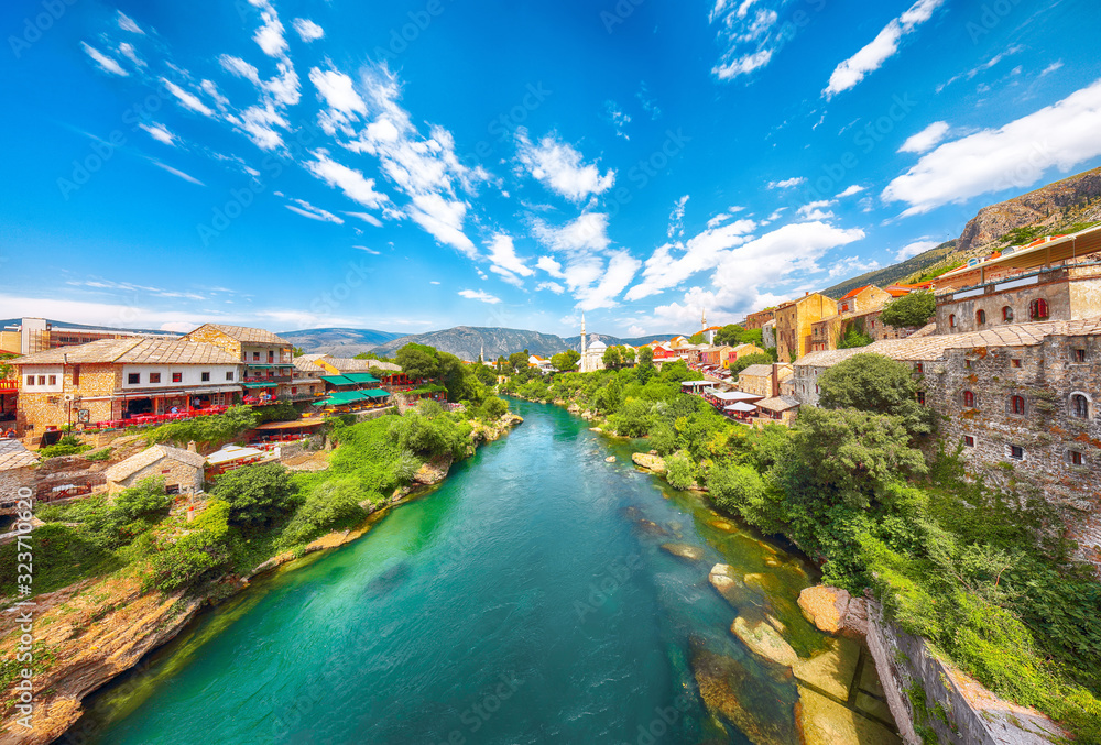 Nerteva River and Old City of Mostar, with Ottoman Mosque  during sunny day