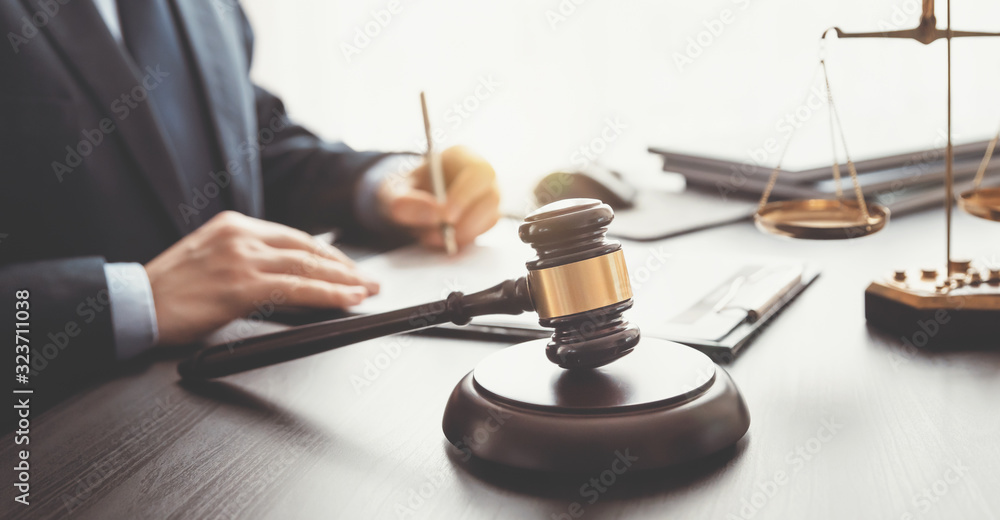 Lawyer, attorney with gavel at work. Law concept Lawyer, attorney with gavel at work. Law concept