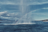 Rainbow from the spray of the Geneva Fountain over the lake.