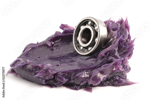 Fotografie Automotive and Industrial close up grease, Ball bearing put on the Lithium complex  multipurpose grease NLGI 3 (Purple) isolated on white background