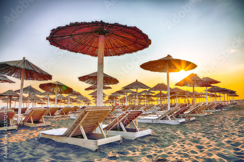 Sun umbrellas and deckchairs on the Copacabana beach  part of Great Beach  Velika Plaza  in Ulcinj