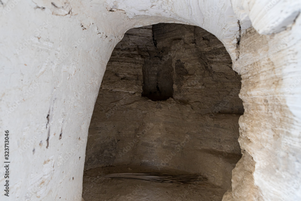 Man-made  caves of the hermits located next to the monastery of Gerasim Jordanian - Deir Hijleh - in the Judean desert near the city of Jericho in Israel