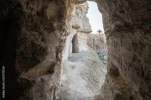 Man-made caves of the hermits located next to the monastery of Gerasim Jordanian - Deir Hijleh - in the Judean desert near the city of Jericho in Israel