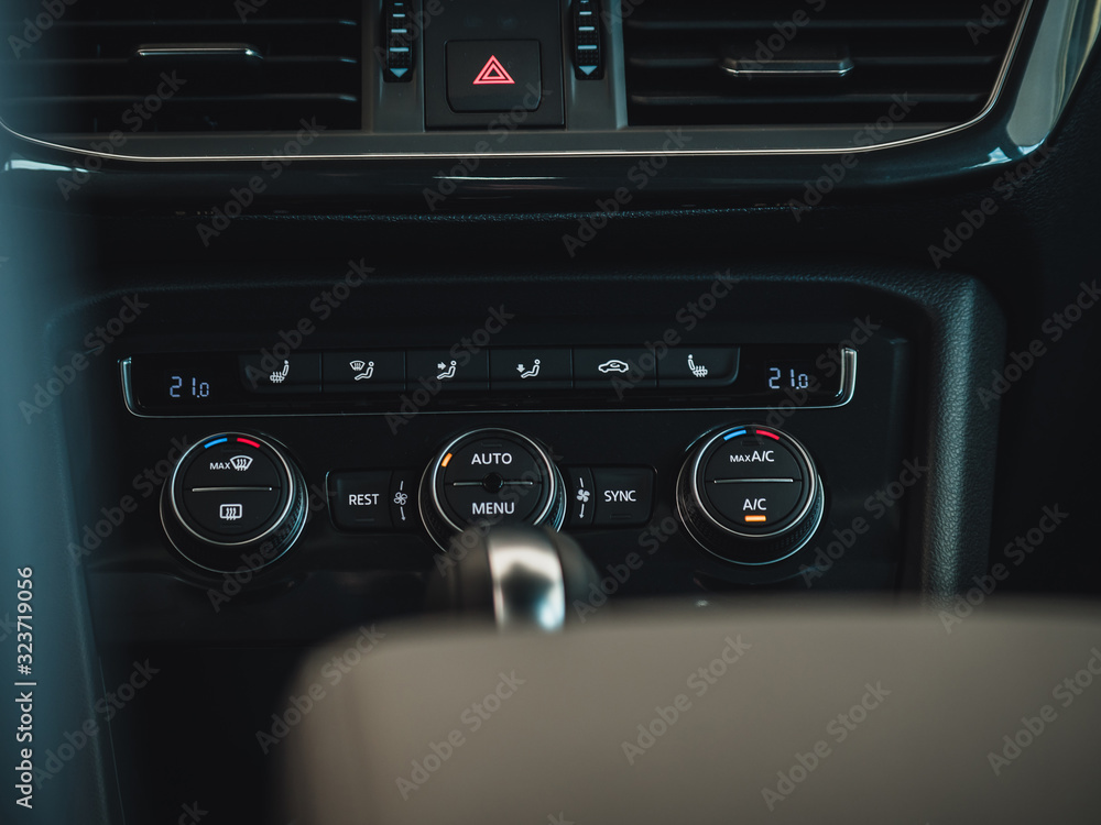 Fototapeta premium Color detail with the air conditioning button inside a car. Car interior. Car air condition.