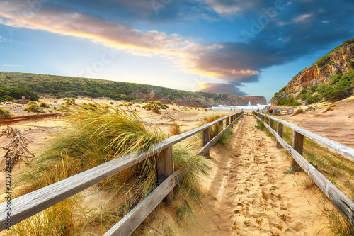 Charming view of beach Cala Domestica with marvelous sand dunes.