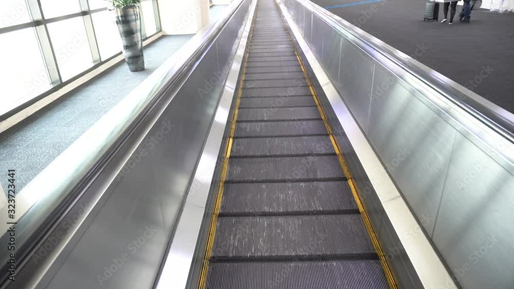 The automatic escalators in airport terminal don Muang, Bangkok, Thailand The automatic escalators in airport terminal don Muang, Bangkok, Thailand