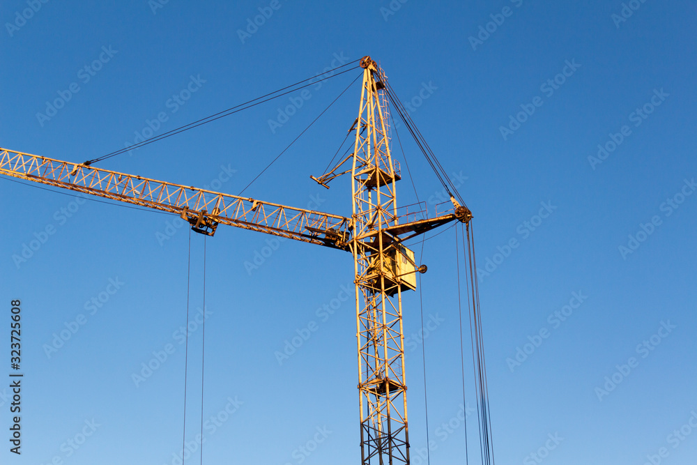 tower crane erecting houses as a background