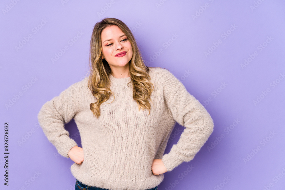 Fototapeta premium Young caucasian woman isolated on purple background dreaming of achieving goals and purposes