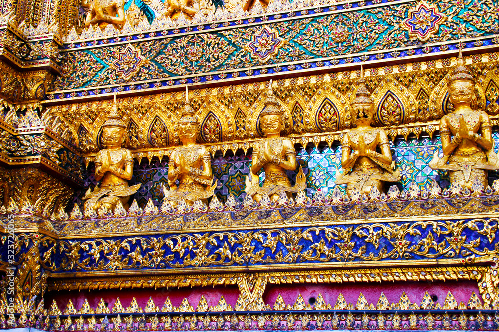 Sculptures in the temple in the Grand palace area. Bangkok, Thailand.