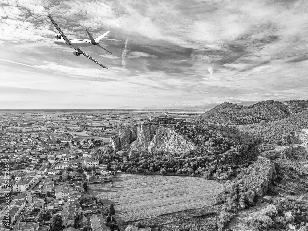 Fototapeta premium Aerial view from drone of a small village on hill in Tuscany