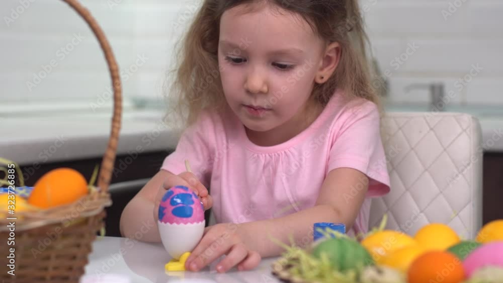 Happy easter. Little girl painting Easter eggs. Happy family children preparing for Easter. Cute little child girl wearing bunny ears on Easter day. Happy easter. Little girl painting Easter eggs. Happy family children preparing for Easter. Cute little child girl wearing bunny ears on Easter day.