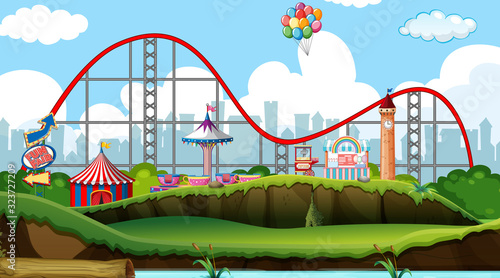 Scene with roller coaster and other rides in the park