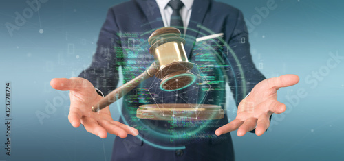 Businessman holding a Justice hammer and data - 3d rendering