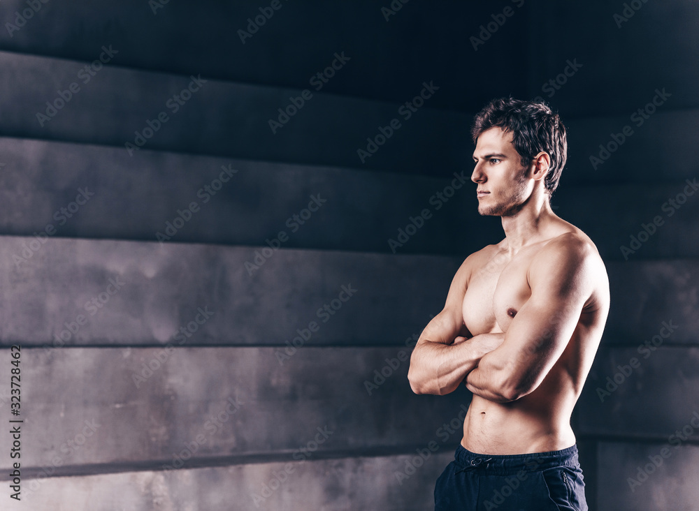 Brutal strong bodybuilder athletic fitness man.