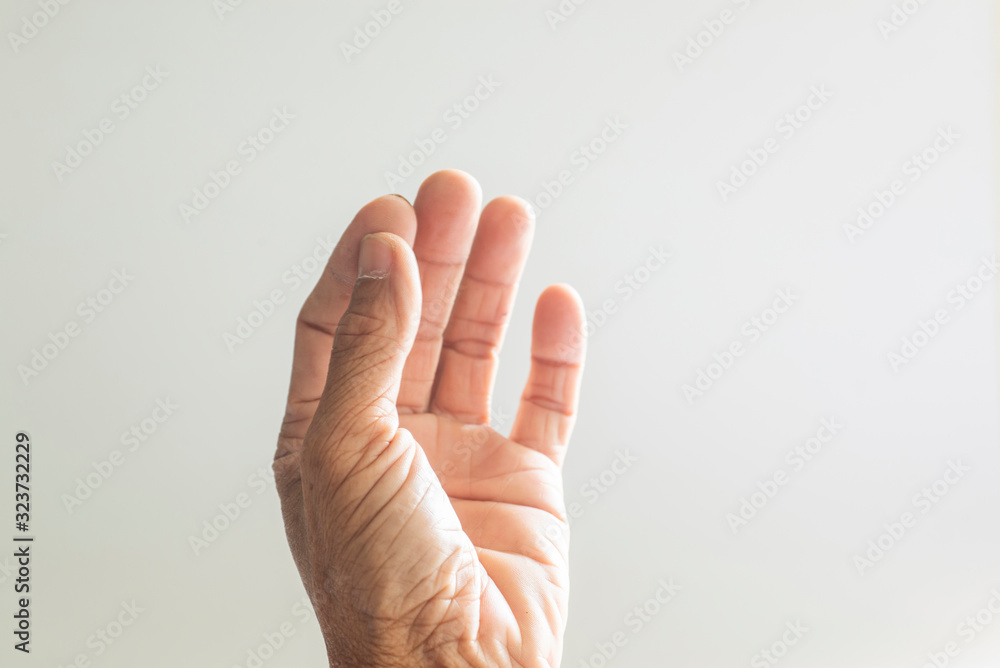 The hands and fingers of the elderly gestures shown on a white background The hands and fingers of the elderly gestures shown on a white background