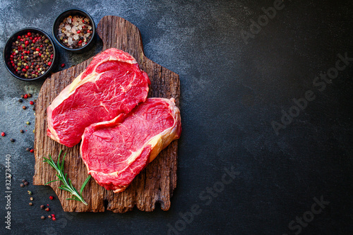 Картината върху платно raw steak meat (beef or veal cooking) menu concept background