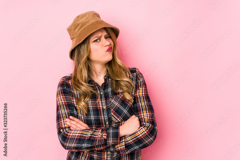 Young caucasian woman wearing a hat isolated unhappy looking in camera with sarcastic expression. Young caucasian woman wearing a hat isolated unhappy looking in camera with sarcastic expression.