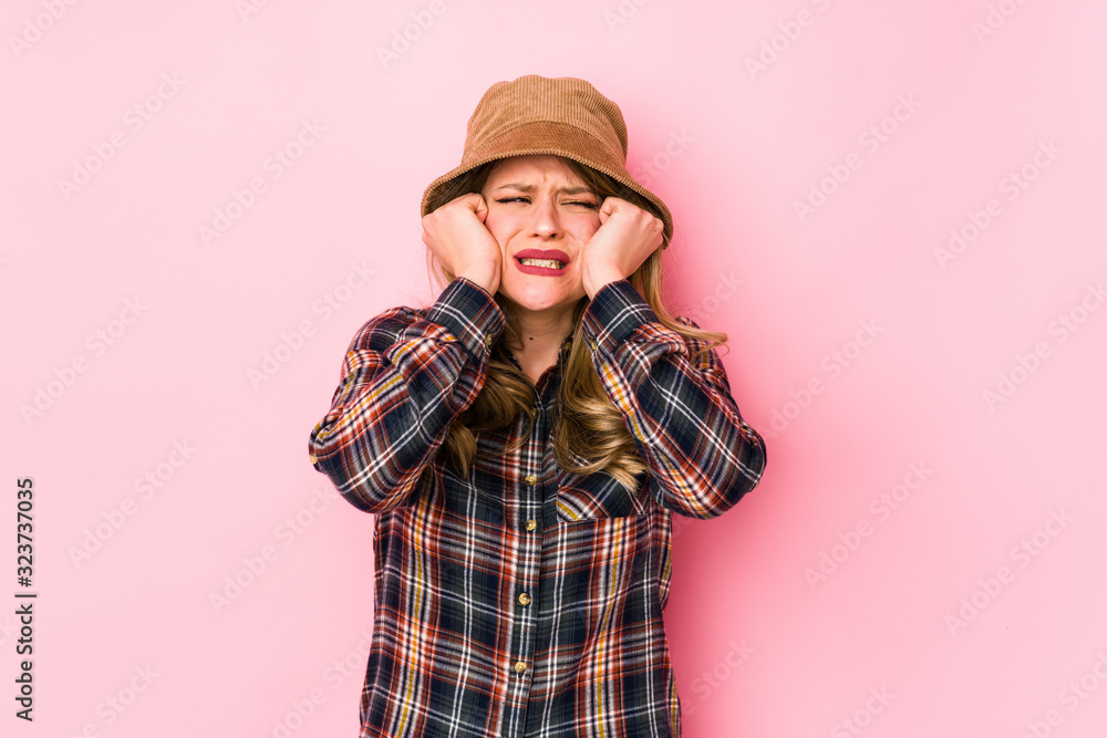 Young caucasian woman wearing a hat isolated crying, unhappy with something, agony and confusion concept. Young caucasian woman wearing a hat isolated crying, unhappy with something, agony and confusion concept.