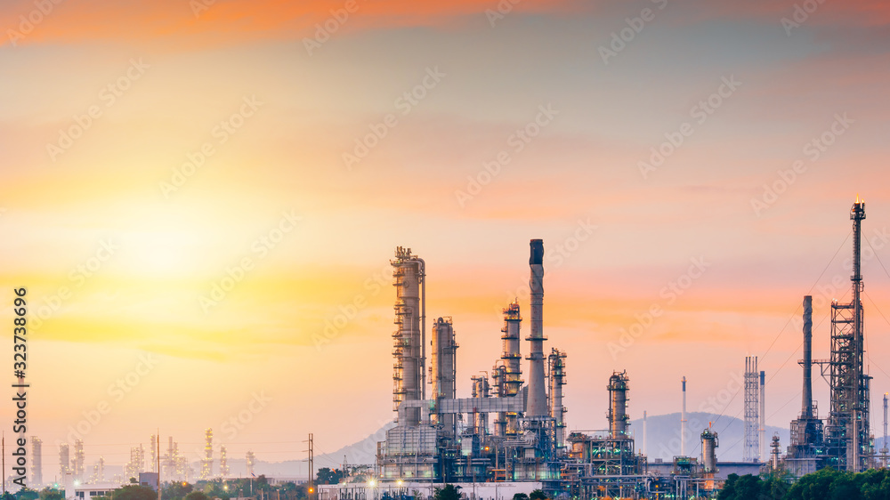 Fototapeta premium Aerial view oil refinery night background during twilight,Industrial zone,Energy power station.