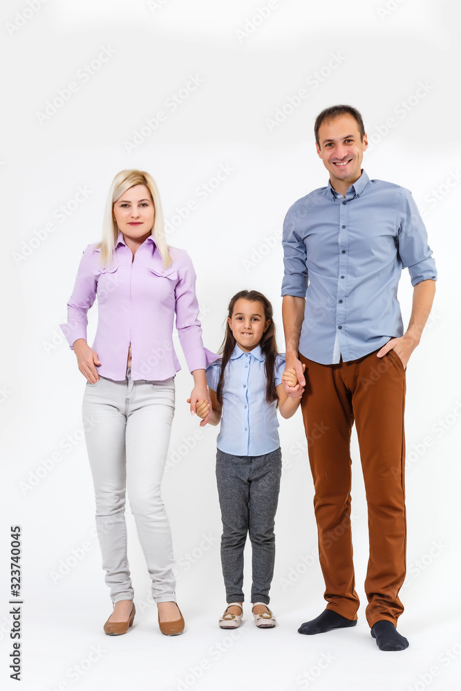 Happy young family with pretty child posing on white background Happy young family with pretty child posing on white background