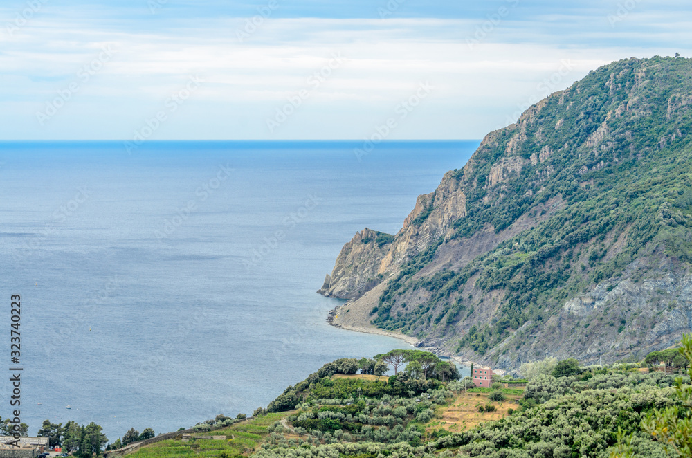 Majestic mountain ocean view from famous trail between Monterosso and Vernazza, Italy.