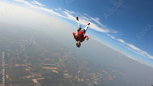 Planet. Skydiver travels around the world. There are no rules for brave people. The sky without borders.