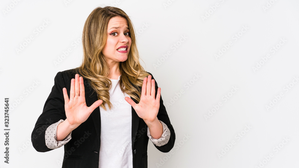 Young caucasian business woman isolated on white background Young caucasian bussines womanrejecting someone showing a gesture of disgust. Young caucasian business woman isolated on white background Young caucasian bussines womanrejecting someone showing a gesture of disgust.