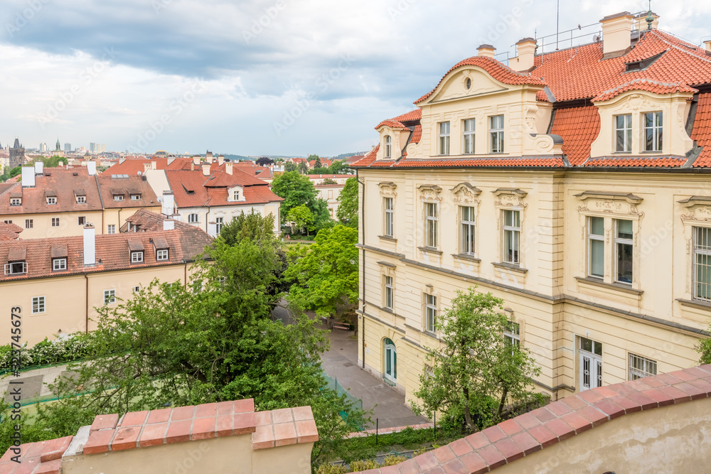 View of the top of old buildings with red roof and dramatic sky at Prague city Czech republic. View of the top of old buildings with red roof and dramatic sky at Prague city Czech republic.