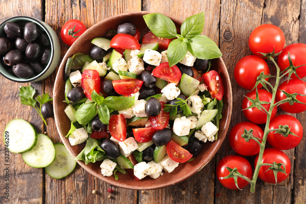 mixed salad with tomato, olive, feta cheese, basil and sauce