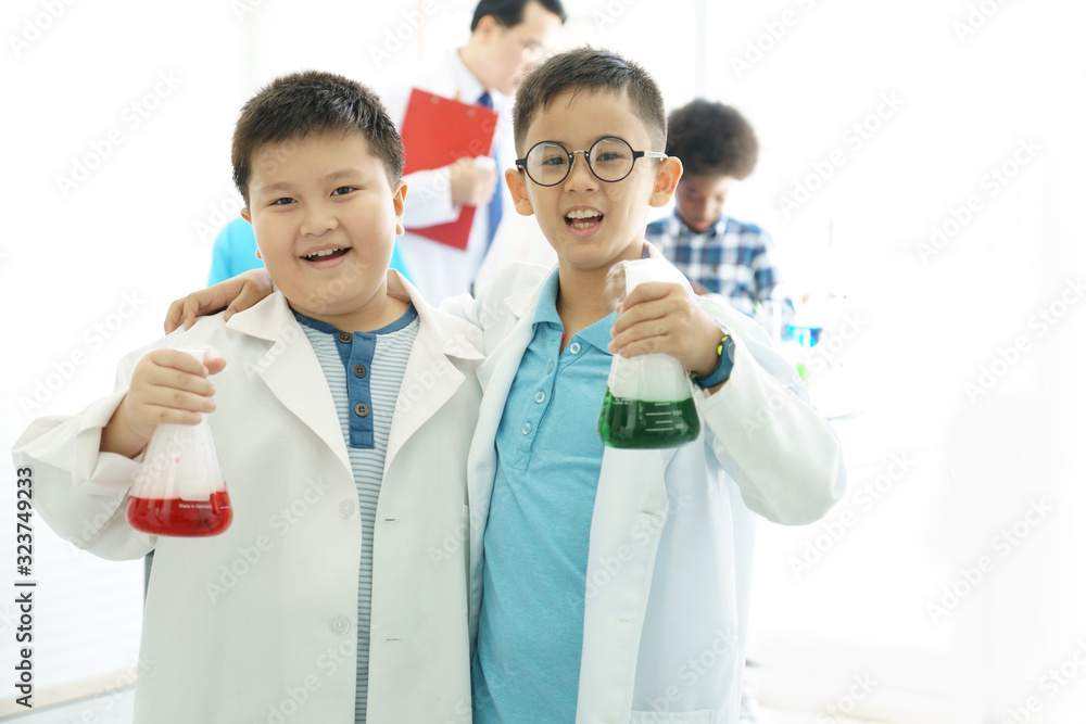 2 boys testing chemistry lab experiment 2 boys testing chemistry lab experiment
