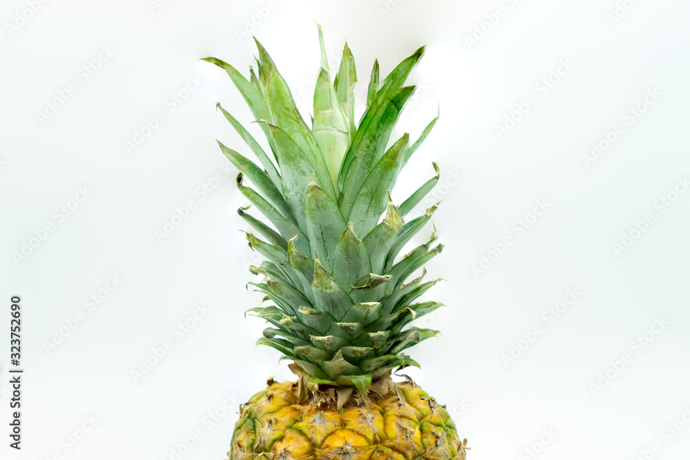 View of Pineapple isolated on white background in the center of the image. Healthy food concept.