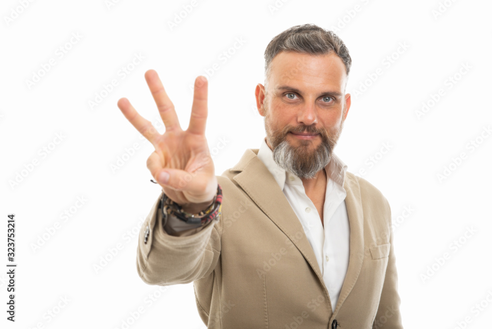 Portrait of handsome man wearing smart casual clothes showing three Portrait of handsome man wearing smart casual clothes showing three