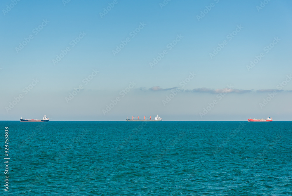 Three ships on the black sea horizon