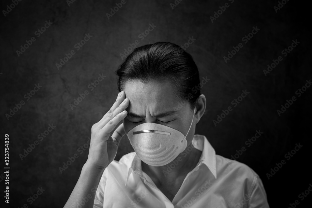 Woman scared and strain is wearing a mask. - Protection against virus, infection, exhaust and industrial emissions. Woman scared and strain is wearing a mask. - Protection against virus, infection, exhaust and industrial emissions.