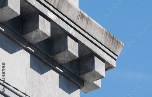 Detail of the cornice of a building from the Fascist period, entirely made of Italian marble