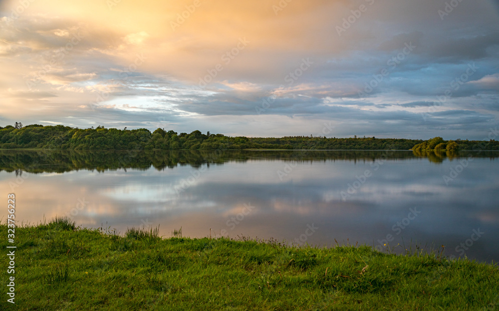 Orange sunset sky and reflection over an irish lake II