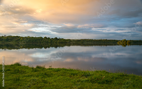 Orange sunset sky and reflection over an irish lake II