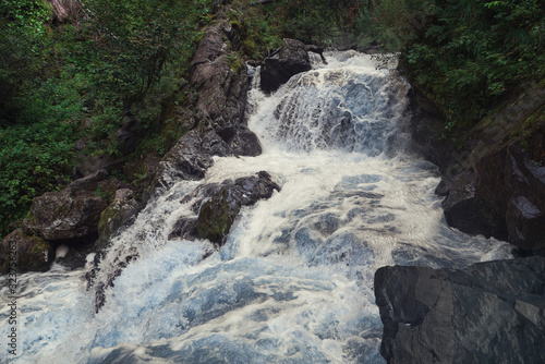 Waterfall in green forest, ...